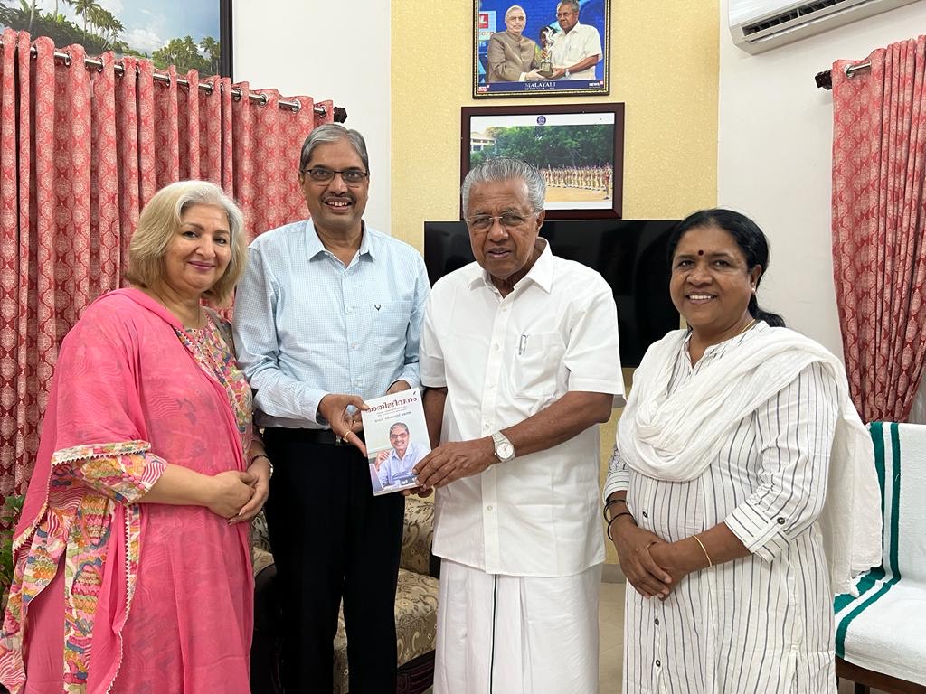 Dr Vishwas Mehta presented a copy of his book Ati Jeevanam (Survival)